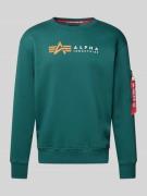 Alpha Industries Sweatshirt mit Label-Print und Reißverschlusstasche i...