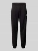 EA7 Emporio Armani Regular Fit Sweatpants mit Label-Print in Black, Gr...