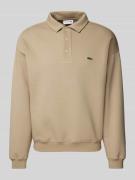 Lacoste Sweatshirt mit Druckknopfleiste in Beige, Größe L