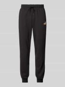 PUMA PERFORMANCE Relaxed Fit Sweatpants mit Label-Print in Black, Größ...