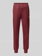 PUMA PERFORMANCE Sweatpants mit Reißverschlusstaschen in Bordeaux, Grö...