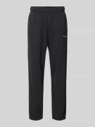 CHAMPION Regular Fit Sweatpants mit Label-Stitching in Black, Größe L