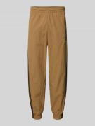 adidas Originals Sweatpants mit elastischem Bund in Beige, Größe L