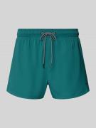 PUMA Badehose mit Seitentaschen und Klettverschlusstasche hinten in Pe...