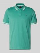 Tommy Jeans Regular Fit Poloshirt aus reiner Baumwolle in Lind, Größe ...
