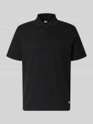 Tommy Jeans Regular Fit Poloshirt aus reiner Baumwolle in Black, Größe...