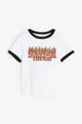 H&M T-Shirt mit Print Weiß/Stranger Things, T-Shirts & Tops in Größe 1...