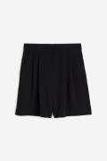 H&M Weite Shorts Schwarz in Größe 50. Farbe: Black