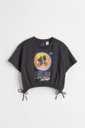 H&M T-Shirt mit Tunnelzug Schwarz/E.T., T-Shirts & Tops in Größe 146/1...