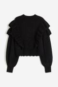 H&M Pullover mit Volants Schwarz in Größe L. Farbe: Black