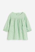 H&M Kleid mit Taschen Hellgrün/Geblümt, Kleider in Größe 86. Farbe: Li...