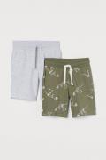 H&M 2er-Pack Sweatshorts Khakigrün/Dinosaurierskelette in Größe 92. Fa...